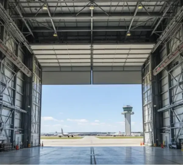Industrial oversized door system with high-clearance opening for warehouses and hangars