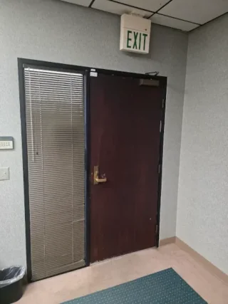 Corporate office emergency exit door with safety hardwar.